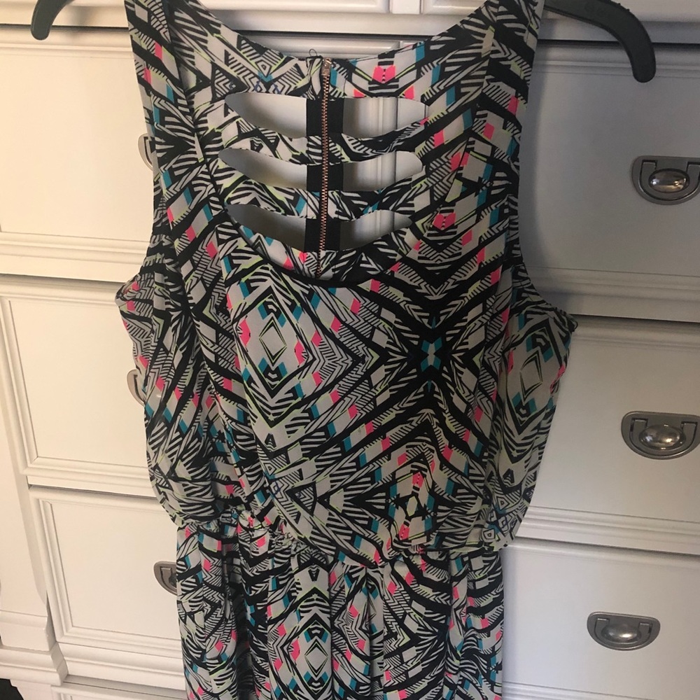 Cute cut out back romper with pockets!